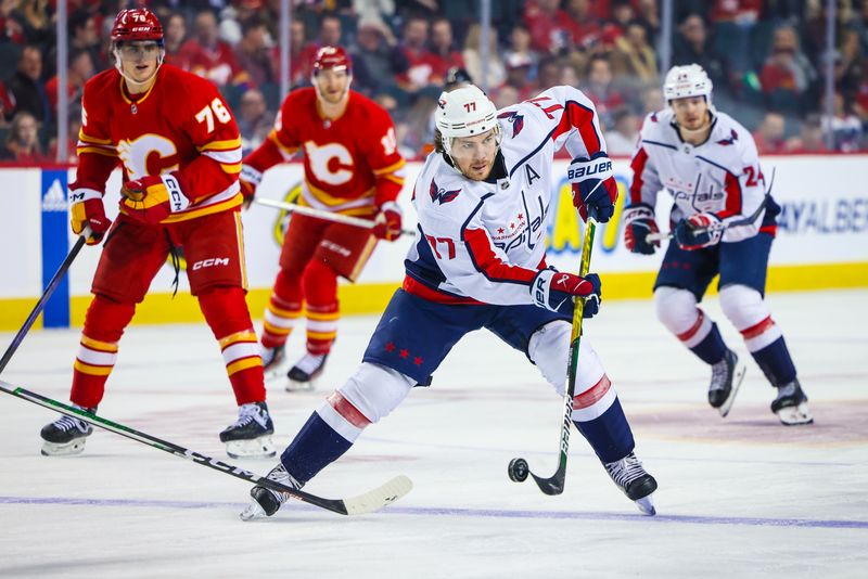 Mar 18, 2024; Calgary, Alberta, CAN; Washington Capitals right wing T.J. Oshie (77) controls the puck against the Calgary Flames during the first period at Scotiabank Saddledome. Mandatory Credit: Sergei Belski-USA TODAY Sports