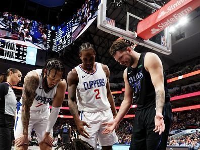 DALLAS, TEXAS - DECEMBER 20: Luka Doncic #77 of the Dallas Mavericks reacts after he was fouled by Terance Mann #14 of the LA Clippers in the first half at American Airlines Center on December 20, 2023 in Dallas, Texas. NOTE TO USER: User expressly acknowledges and agrees that, by downloading and or using this photograph, User is consenting to the terms and conditions of the Getty Images License Agreement. (Photo by Tim Heitman/Getty Images)