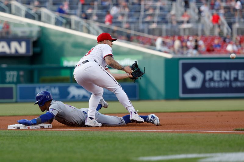 Jun 3, 2024; Washington, District of Columbia, USA; New York Mets shortstop Francisco Lindor (12) advances to third base ahead of a tag by Washington Nationals third base Nick Senzel (13) during the first inning at Nationals Park. Mandatory Credit: Geoff Burke-USA TODAY Sports