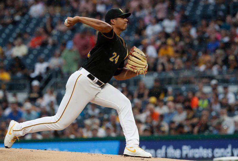 Jul 15, 2023; Pittsburgh, Pennsylvania, USA;  Pittsburgh Pirates starting pitcher Johan Oviedo (24) delivers against the San Francisco Giants during the first inning at PNC Park. Mandatory Credit: Charles LeClaire-USA TODAY Sports