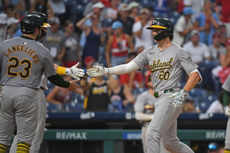 Jul 14, 2024; Philadelphia, Pennsylvania, USA; Oakland Athletics second baseman Zack Gelof (20) celebrates his grand slam against the Philadelphia Phillies during the ninth inning at Citizens Bank Park. Mandatory Credit: Eric Hartline-USA TODAY Sports