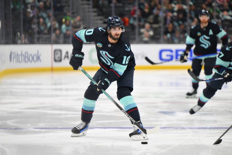 Mar 14, 2024; Seattle, Washington, USA; Seattle Kraken center Matty Beniers (10) looks to pass the puck during the second period against the Washington Capitals at Climate Pledge Arena. Mandatory Credit: Steven Bisig-USA TODAY Sports