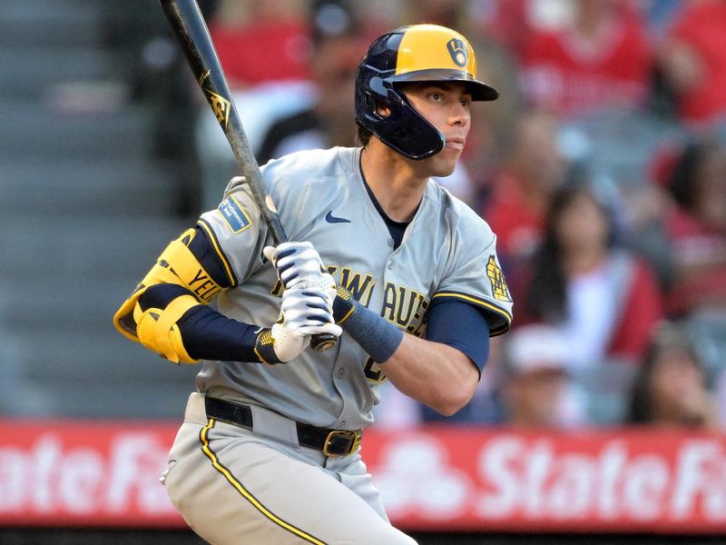 Jun 19, 2024; Anaheim, California, USA;  Milwaukee Brewers left fielder Christian Yelich (22) doubles in the third inning against the Los Angeles Angels at Angel Stadium. Mandatory Credit: Jayne Kamin-Oncea-USA TODAY Sports