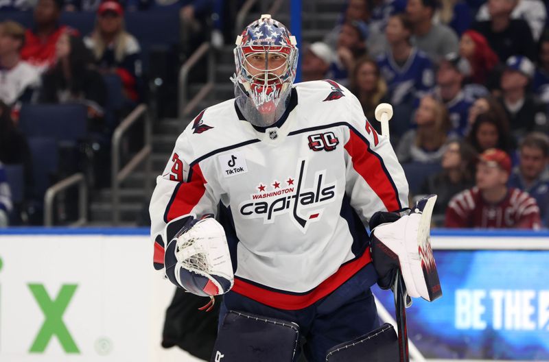 Oct 26, 2024; Tampa, Florida, USA; Washington Capitals goaltender Charlie Lindgren (79) against the Tampa Bay Lightning during the first period at Amalie Arena. Mandatory Credit: Kim Klement Neitzel-Imagn Images