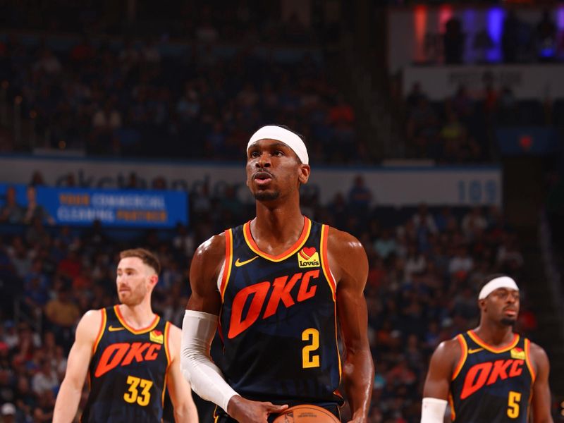 OKLAHOMA CITY, OK - APRIL 14:  Shai Gilgeous-Alexander #2 of the Oklahoma City Thunder shoots a free throw during the game against the Dallas Mavericks on April 14, 2024 at Paycom Arena in Oklahoma City, Oklahoma. NOTE TO USER: User expressly acknowledges and agrees that, by downloading and or using this photograph, User is consenting to the terms and conditions of the Getty Images License Agreement. Mandatory Copyright Notice: Copyright 2024 NBAE (Photo by Zach Beeker/NBAE via Getty Images)