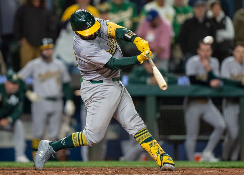 Sep 28, 2024; Seattle, Washington, USA; Oakland Athletics catcher Shea Langeliers (23) hits a three-run home run during the ninth inning against the Seattle Mariners at T-Mobile Park. Mandatory Credit: Stephen Brashear-Imagn Images