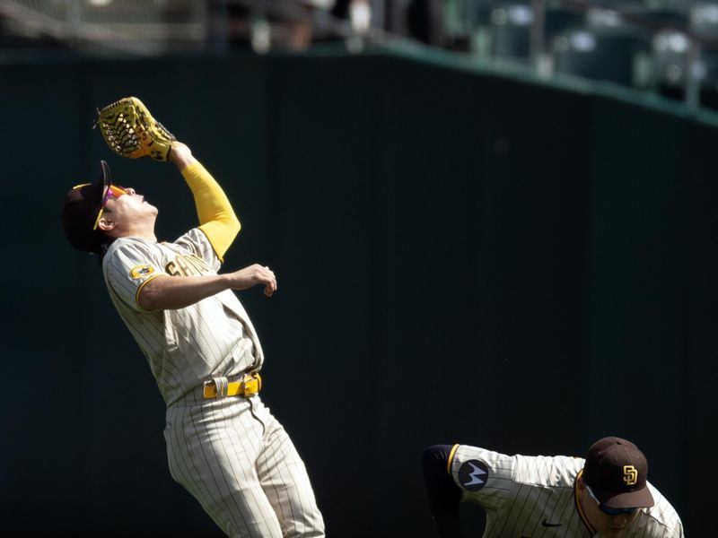 Sep 16, 2023; Oakland, California, USA; San Diego Padres second baseman Ha-Seong Kim (7) backpedals to make the catch of a popup during the second inning at Oakland-Alameda County Coliseum. Mandatory Credit: D. Ross Cameron-USA TODAY Sports