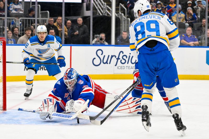 Dec 18, 2025; St. Louis, Missouri, USA; New York Rangers goaltender Igor Shesterkin (31) dives to cover the puck and defend the net against St. Louis Blues left wing Pavel Buchnevich (89) during the second period at Enterprise Center. Mandatory Credit: Jeff Curry-Imagn Images