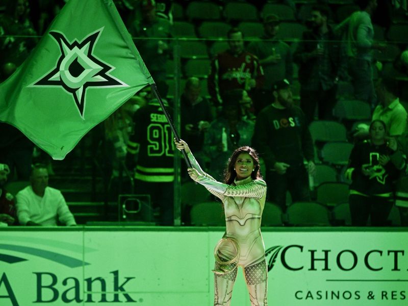 Oct 27, 2022; Dallas, Texas, USA; The Dallas Stars ice girls wave a victory flag after the Stars win over the Washington Capitals at the American Airlines Center. Mandatory Credit: Jerome Miron-USA TODAY Sports