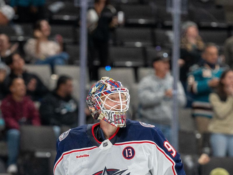 Nov 5, 2024; San Jose, California, USA;  Columbus Blue Jackets goaltender Elvis Merzlikins (90) reacts after the goal by San Jose Sharks defenseman Jack Thompson (not pictured) during the second period at SAP Center at San Jose. Mandatory Credit: Neville E. Guard-Imagn Images