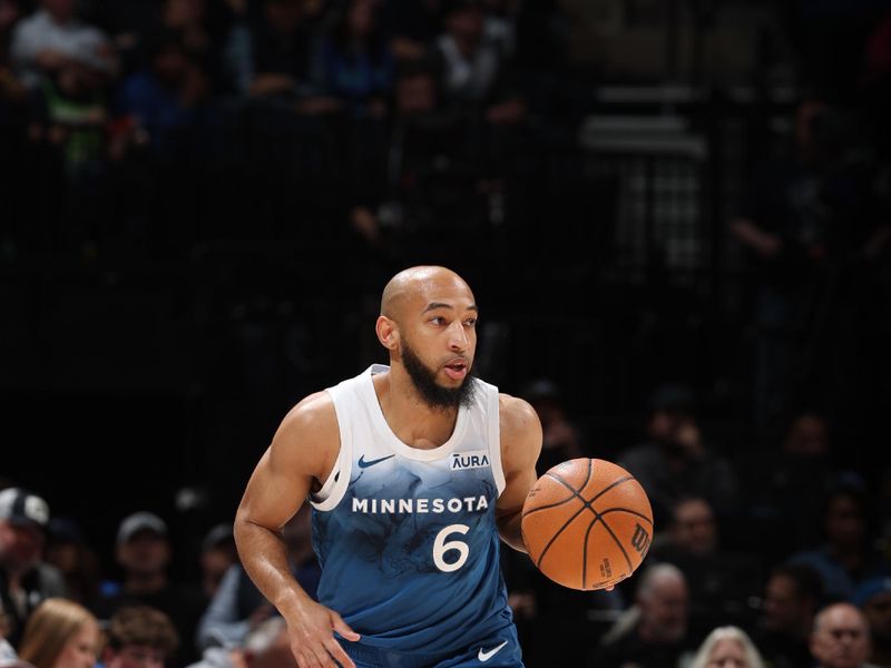 MINNEAPOLIS, MN -  APRIL 12:  Jordan McLaughlin #6 of the Minnesota Timberwolves handles the ball during the game against the Atlanta Hawks on April 12, 2024 at Target Center in Minneapolis, Minnesota. NOTE TO USER: User expressly acknowledges and agrees that, by downloading and or using this Photograph, user is consenting to the terms and conditions of the Getty Images License Agreement. Mandatory Copyright Notice: Copyright 2024 NBAE (Photo by David Sherman/NBAE via Getty Images)