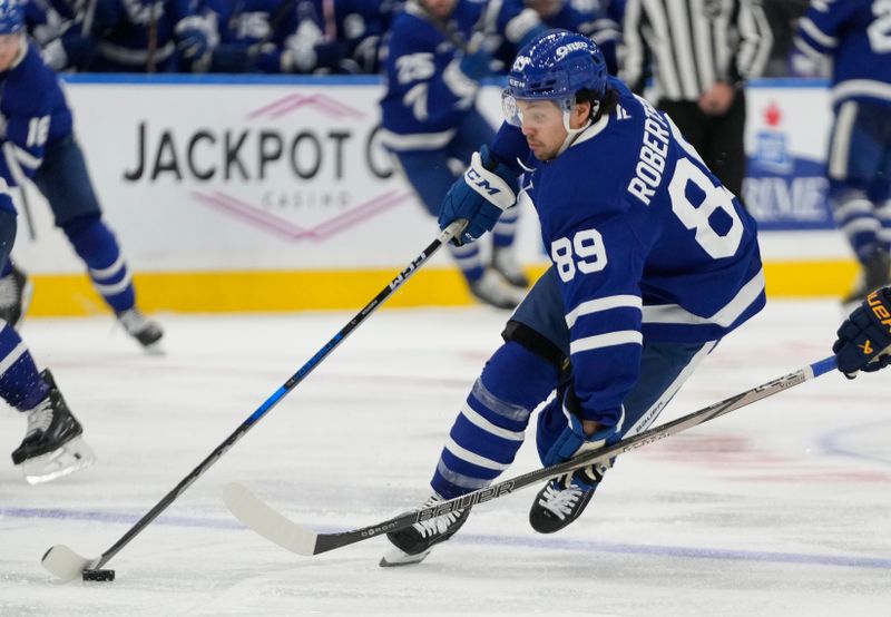 Oct 24, 2024; Toronto, Ontario, CAN; Toronto Maple Leafs forward Nicholas Robertson (89) carries th epuck against the St. Louis Blues during the third period at Scotiabank Arena. Mandatory Credit: John E. Sokolowski-Imagn Images