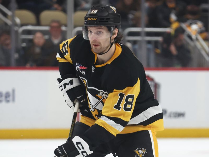Nov 26, 2025; Pittsburgh, Pennsylvania, USA; Pittsburgh Penguins center Tommy Novak (18) skates with the puck against the Buffalo Sabres during the third period at PPG Paints Arena. Mandatory Credit: Charles LeClaire-Imagn Images