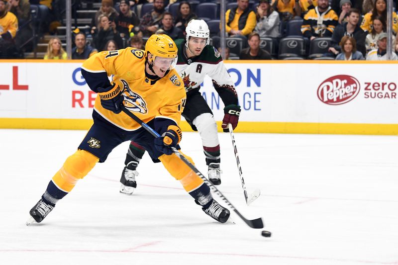 Nov 11, 2023; Nashville, Tennessee, USA; Nashville Predators left wing Gustav Nyquist (14) scores during the first period against the Arizona Coyotes at Bridgestone Arena. Mandatory Credit: Christopher Hanewinckel-USA TODAY Sports