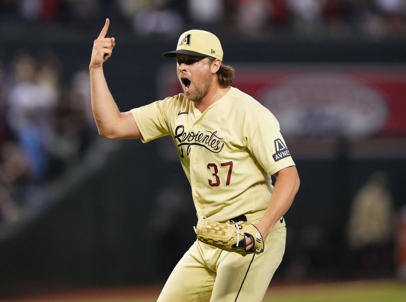 Aug 25, 2023; Phoenix, Arizona, USA;  Arizona Diamondbacks relief pitcher Kevin Ginkel (37) celebrates after defeating the Cincinnati Reds at Chase Field. Mandatory Credit: Joe Camporeale-USA TODAY Sports