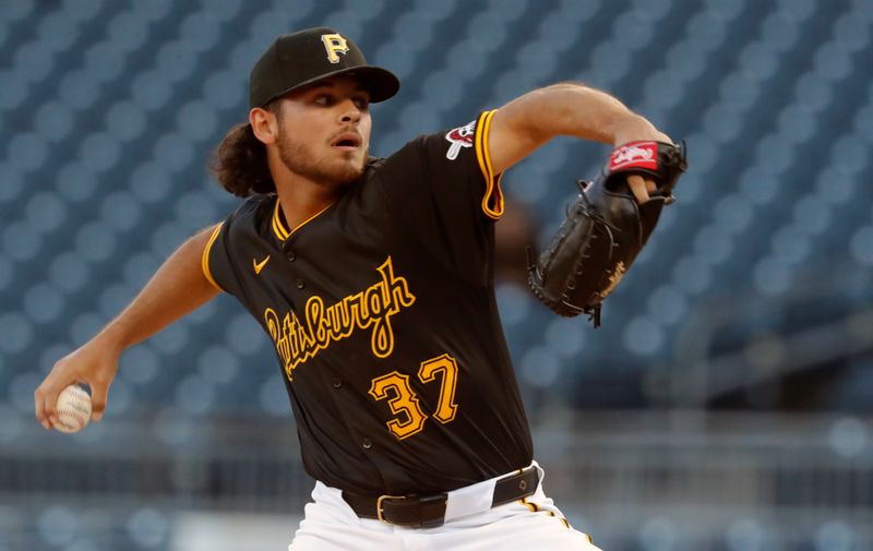 Apr 22, 2024; Pittsburgh, Pennsylvania, USA;  Pittsburgh Pirates starting pitcher Jared Jones (37) delivers a pitch against the Milwaukee Brewers during the first inning at PNC Park. Mandatory Credit: Charles LeClaire-USA TODAY Sports