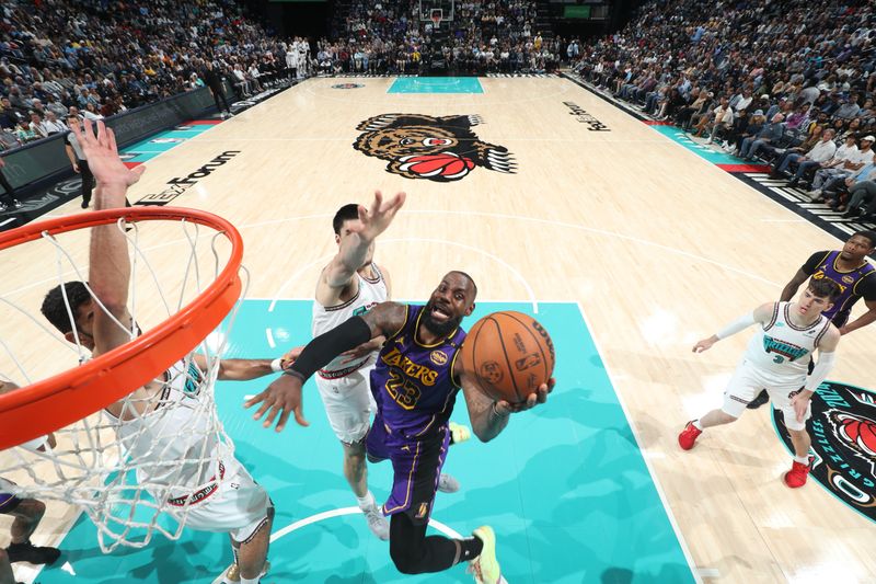 MEMPHIS, TN - NOVEMBER 6: LeBron James #23 of the Los Angeles Lakers drives to the basket during the game against the Memphis Grizzlies on November 6, 2024 at FedExForum in Memphis, Tennessee. NOTE TO USER: User expressly acknowledges and agrees that, by downloading and or using this photograph, User is consenting to the terms and conditions of the Getty Images License Agreement. Mandatory Copyright Notice: Copyright 2024 NBAE (Photo by Joe Murphy/NBAE via Getty Images)