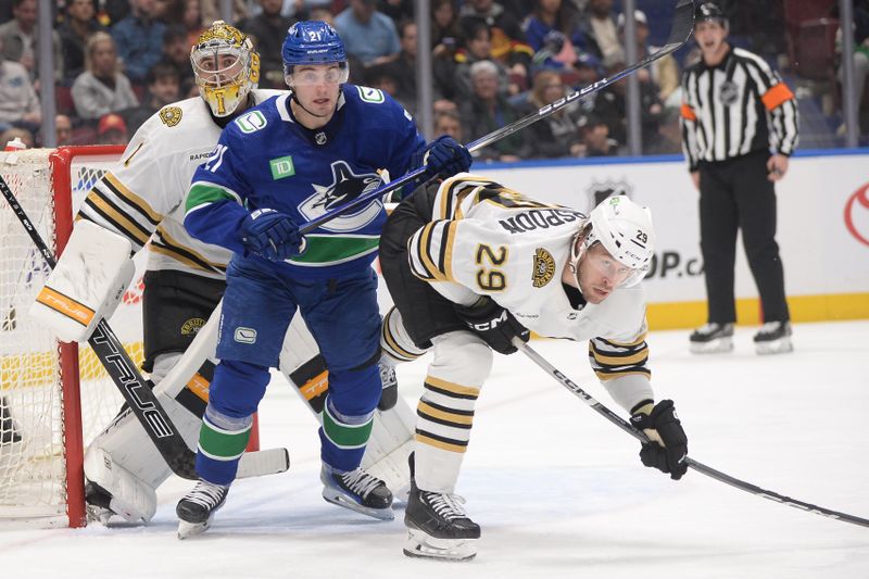 Feb 24, 2024; Vancouver, British Columbia, CAN;  Boston Bruins defenseman Parker Wotherspoon (29) defends against Vancouver Canucks forward Nils Hoglander (21) during the third period at Rogers Arena. Mandatory Credit: Anne-Marie Sorvin-USA TODAY Sports