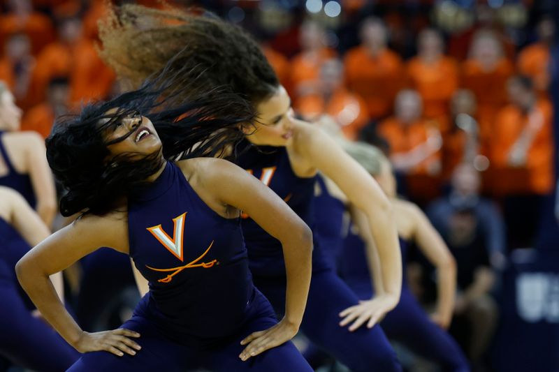 Jan 24, 2024; Charlottesville, Virginia, USA; Members of the Virginia Cavaliers Dance Team dance during a timeout against the North Carolina State Wolfpack in the second half at John Paul Jones Arena. Mandatory Credit: Geoff Burke-USA TODAY Sports