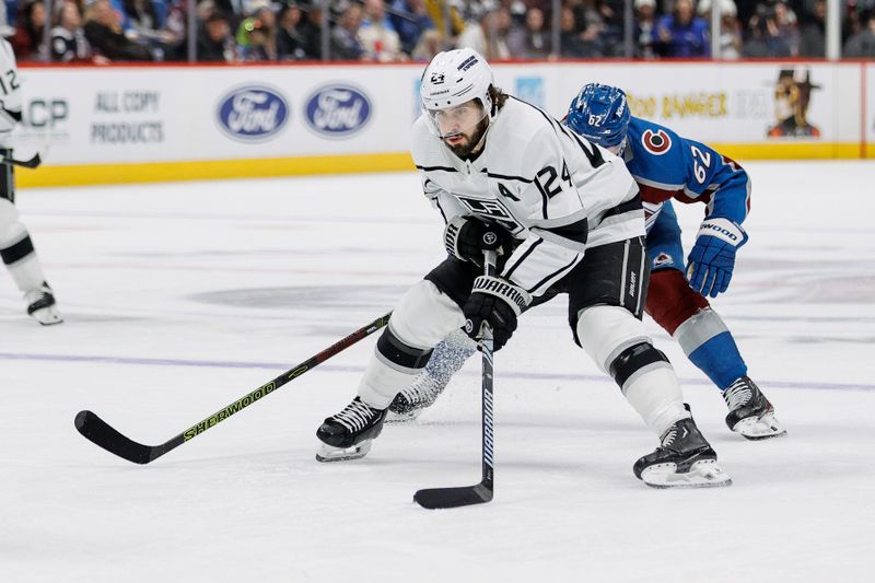 Jan 26, 2024; Denver, Colorado, USA; Los Angeles Kings center Phillip Danault (24) controls the puck ahead of Colorado Avalanche left wing Artturi Lehkonen (62) in the third period at Ball Arena. Mandatory Credit: Isaiah J. Downing-USA TODAY Sports