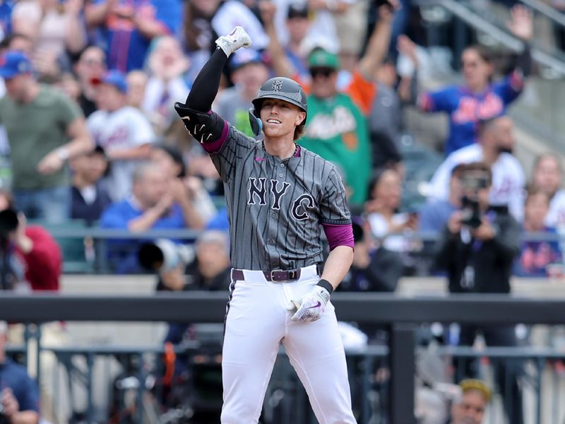 May 31, 2025; New York City, New York, USA; New York Mets third baseman Brett Baty (7) celebrates his three run triple against the Colorado Rockies during the first inning at Citi Field. Mandatory Credit: Brad Penner-Imagn Images