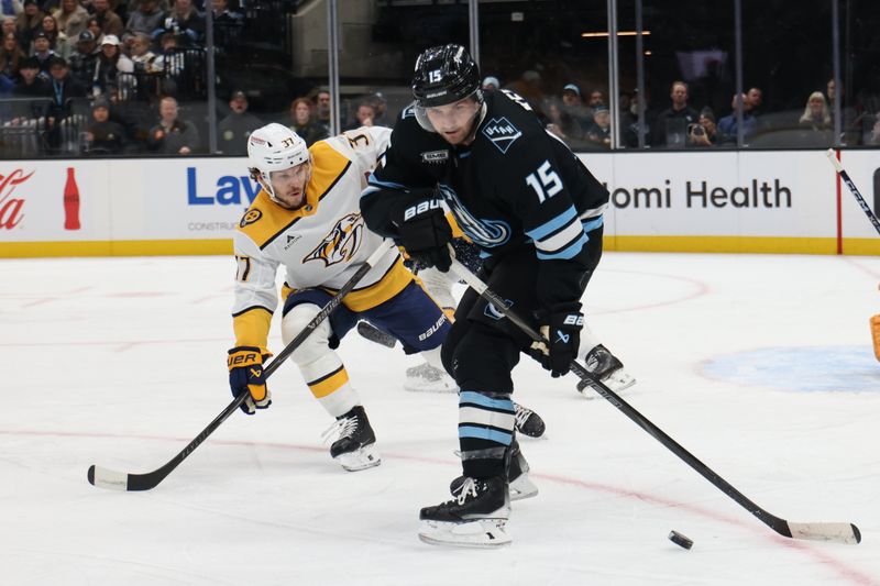 Dec 29, 2025; Salt Lake City, Utah, USA; Utah Mammoth center Alexander Kerfoot (15) skates with the puck against Nashville Predators defenseman Nick Blankenburg (37) during the first period at Delta Center. Mandatory Credit: Rob Gray-Imagn Images