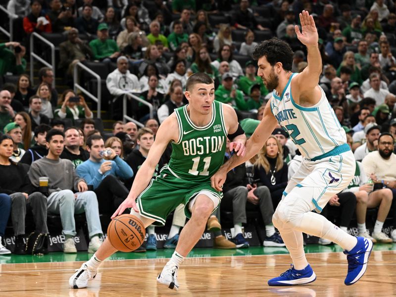 BOSTON, MASSACHUSETTS - APRIL 12: Payton Pritchard #11 of the Boston Celtics drives to the basket against Vasilije Micic #22 of the Charlotte Hornets during the first quarter at the TD Garden on April 12, 2024 in Boston, Massachusetts. NOTE TO USER: User expressly acknowledges and agrees that, by downloading and or using this photograph, User is consenting to the terms and conditions of the Getty Images License Agreement. (Photo by Brian Fluharty/Getty Images)