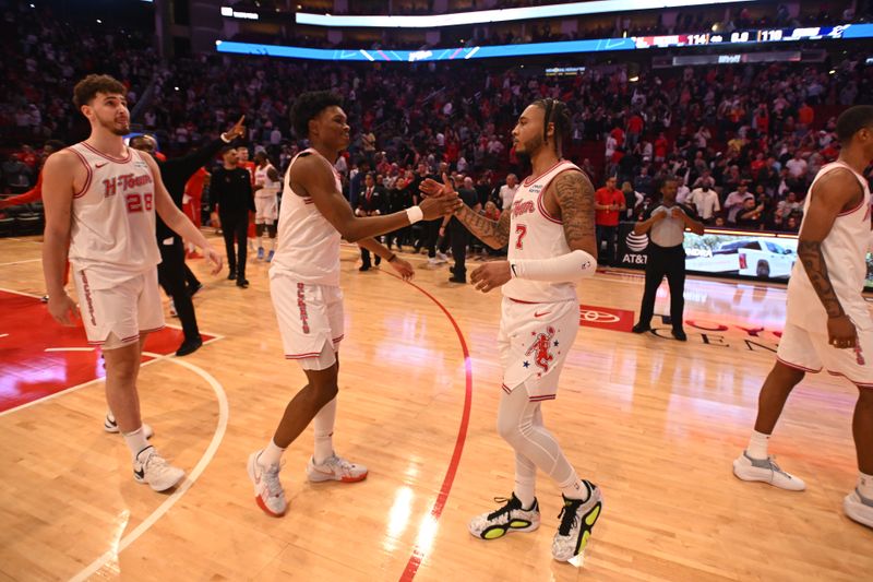 HOUSTON, TX - FEBRUARY 23:  Amen Thompson #1 high fives Cam Whitmore #7 of the Houston Rockets after the game against the Phoenix Suns on February 23, 2024 at the Toyota Center in Houston, Texas. NOTE TO USER: User expressly acknowledges and agrees that, by downloading and or using this photograph, User is consenting to the terms and conditions of the Getty Images License Agreement. Mandatory Copyright Notice: Copyright 2024 NBAE (Photo by Logan Riely/NBAE via Getty Images)