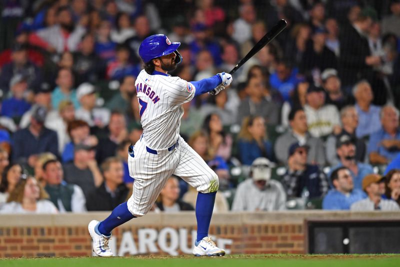 Aug 20, 2024; Chicago, Illinois, USA; Chicago Cubs shortstop Dansby Swanson (7) hits a home run during the sixth inning against the Detroit Tigers at Wrigley Field. Mandatory Credit: Patrick Gorski-USA TODAY Sports