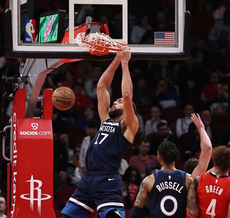 HOUSTON, TEXAS - JANUARY 23: Rudy Gobert #27 of the Minnesota Timberwolves dunks against the Houston Rockets during the second quarter at Toyota Center on January 23, 2023 in Houston, Texas.  NOTE TO USER: User expressly acknowledges and agrees that, by downloading and or using this photograph, User is consenting to the terms and conditions of the Getty Images License Agreement. (Photo by Bob Levey/Getty Images)