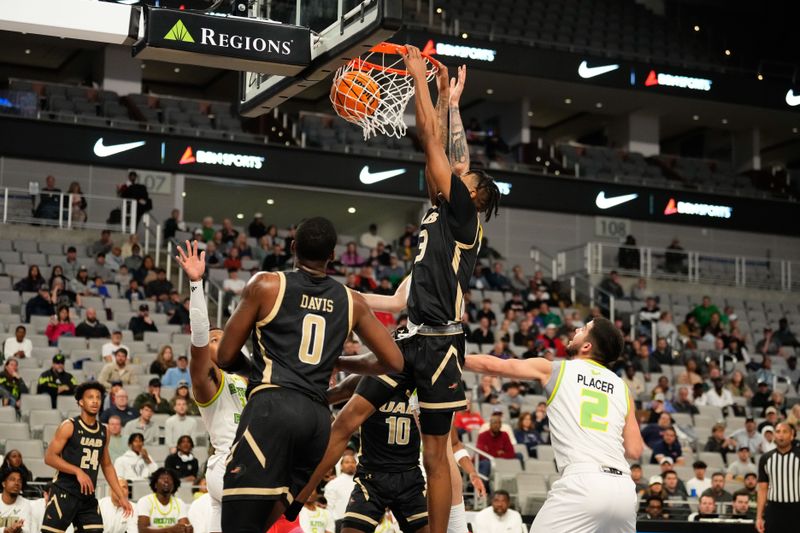 Mar 16, 2024; Fort Worth, TX, USA;  UAB Blazers forward Christian Coleman (13) dunks the ball against South Florida Bulls forward Kasean Pryor (11) during the first half at Dickies Arena. Mandatory Credit: Chris Jones-USA TODAY Sports