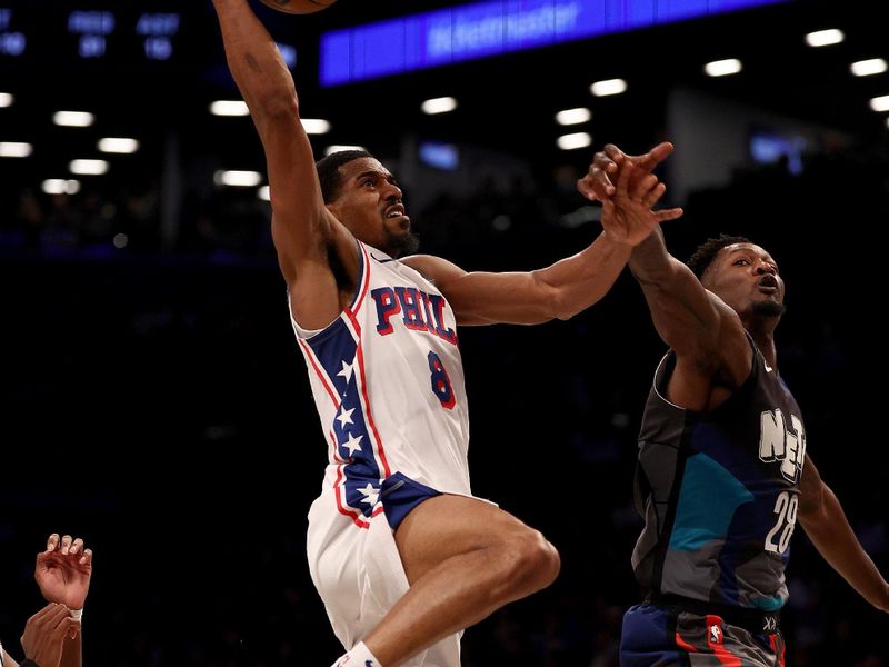 NEW YORK, NEW YORK - NOVEMBER 19:  De'Anthony Melton #8 of the Philadelphia 76ers dunks as Dorian Finney-Smith #28 of the Brooklyn Nets defends in the second half at Barclays Center on November 19, 2023 in the Brooklyn borough of New York City. The Philadelphia 76ers defeated the Brooklyn Nets 121-99. NOTE TO USER: User expressly acknowledges and agrees that, by downloading and or using this photograph, User is consenting to the terms and conditions of the Getty Images License Agreement. (Photo by Elsa/Getty Images)