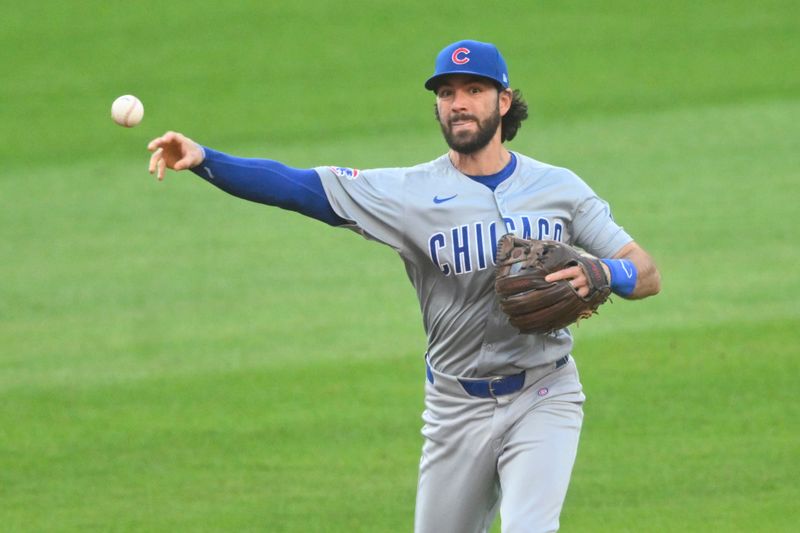 Aug 13, 2024; Cleveland, Ohio, USA; Chicago Cubs shortstop Dansby Swanson (7) throws to first base in the third inning against the Cleveland Guardians at Progressive Field. Mandatory Credit: David Richard-USA TODAY Sports