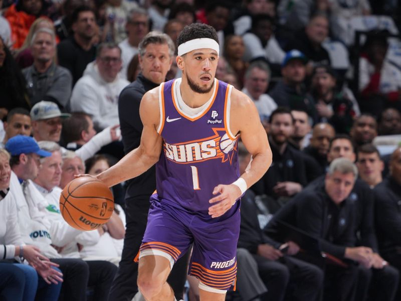 MINNEAPOLIS, MN -  APRIL 20: Devin Booker #1 of the Phoenix Suns dribbles the ball during Round One Game One of the 2024 NBA Playoffs against the Minnesota Timberwolves on April 20, 2024 at Target Center in Minneapolis, Minnesota. NOTE TO USER: User expressly acknowledges and agrees that, by downloading and or using this Photograph, user is consenting to the terms and conditions of the Getty Images License Agreement. Mandatory Copyright Notice: Copyright 2024 NBAE (Photo by Jordan Johnson/NBAE via Getty Images)