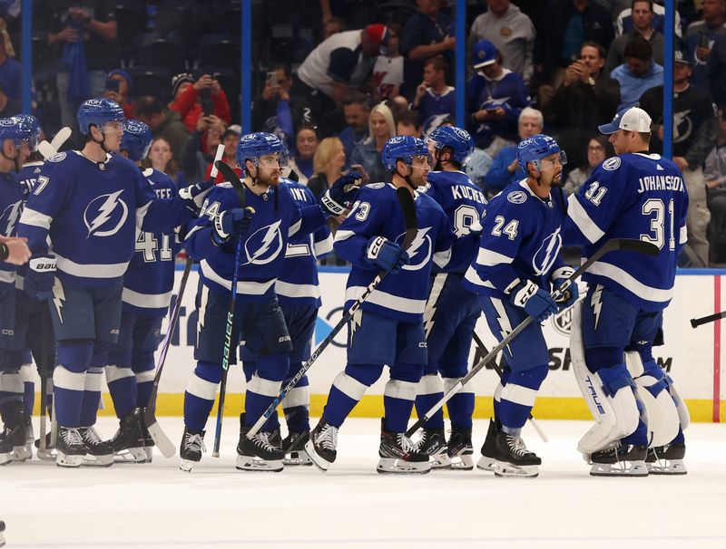 Mar 14, 2024; Tampa, Florida, USA; Tampa Bay Lightning celebrate after they beat the New York Rangers  at Amalie Arena. Mandatory Credit: Kim Klement Neitzel-USA TODAY Sports