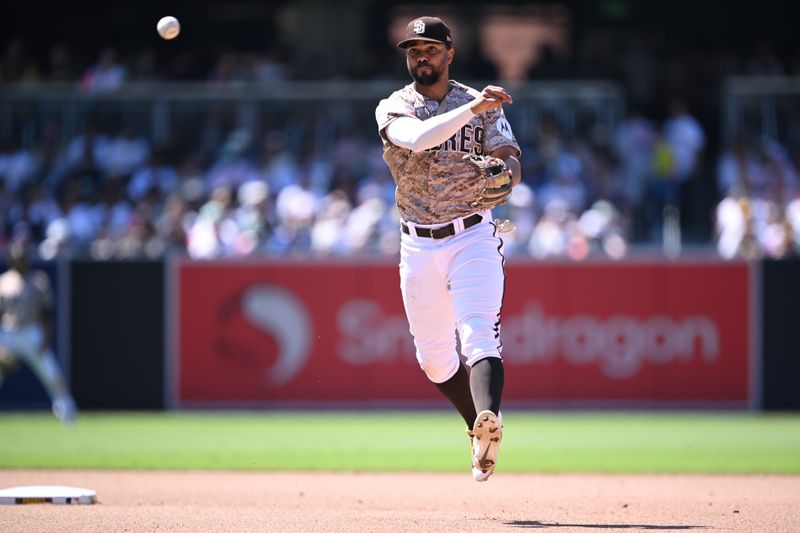 Jul 9, 2023; San Diego, California, USA; San Diego Padres shortstop Xander Bogaerts (2) throws to first base on a ground out by New York Mets right fielder Jeff McNeil (not pictured) during the seventh inning at Petco Park. Mandatory Credit: Orlando Ramirez-USA TODAY Sports