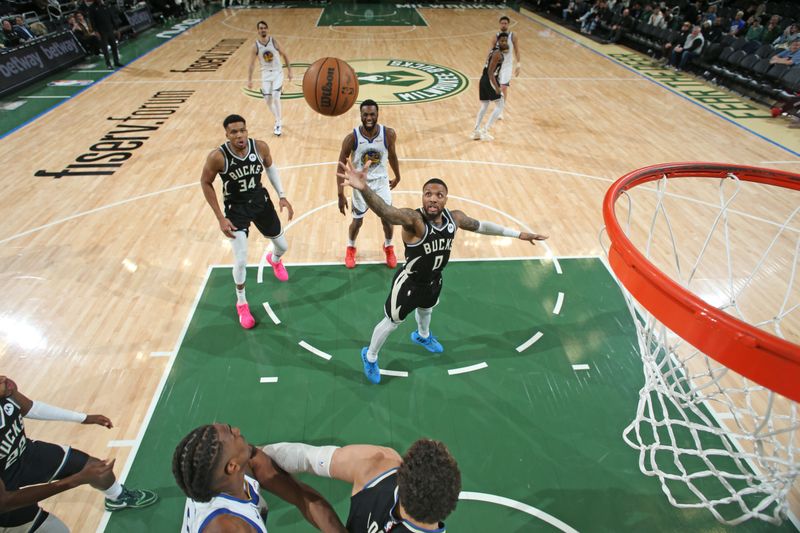 MILWAUKEE, WI - JANUARY 13: Damian Lillard #0 of the Milwaukee Bucks shoots the ball during the game against the Golden State Warriors on January 13, 2024 at the Fiserv Forum Center in Milwaukee, Wisconsin. NOTE TO USER: User expressly acknowledges and agrees that, by downloading and or using this Photograph, user is consenting to the terms and conditions of the Getty Images License Agreement. Mandatory Copyright Notice: Copyright 2024 NBAE (Photo by Gary Dineen/NBAE via Getty Images).