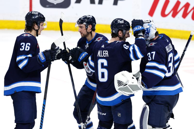 Mar 11, 2024; Winnipeg, Manitoba, CAN; Winnipeg Jets players celebrate their victory over the Washington Capitals at Canada Life Centre. Mandatory Credit: James Carey Lauder-USA TODAY Sports