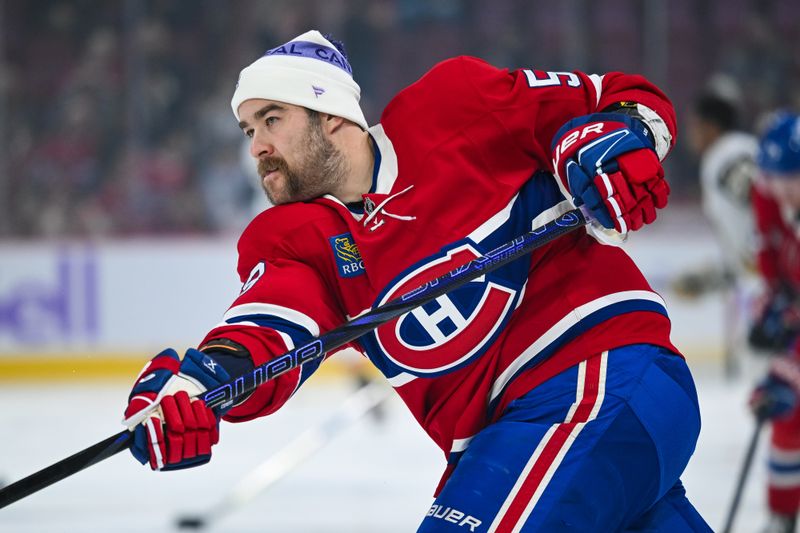 Nov 23, 2024; Montreal, Quebec, CAN; Montreal Canadiens defenseman David Savard (58) looks on wearing a Hockey fights cancer tuque during warm-up before the game against the Las Vegas Golden Knights at Bell Centre. Mandatory Credit: David Kirouac-Imagn Images