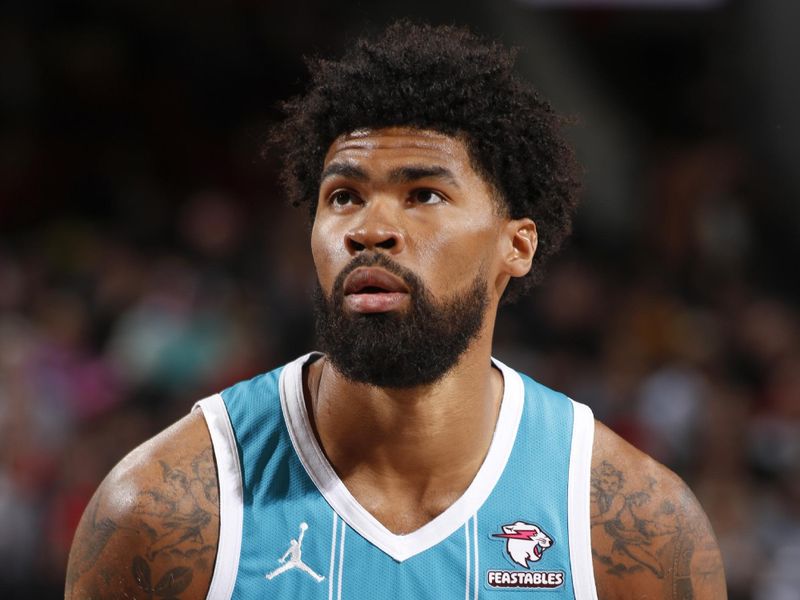 PORTLAND, OR - FEBRUARY 25:  Nick Richards #4 of the Charlotte Hornets shoots a free throw during the game on February 25, 2024 at the Moda Center Arena in Portland, Oregon. NOTE TO USER: User expressly acknowledges and agrees that, by downloading and or using this photograph, user is consenting to the terms and conditions of the Getty Images License Agreement. Mandatory Copyright Notice: Copyright 2024 NBAE (Photo by Cameron Browne/NBAE via Getty Images)