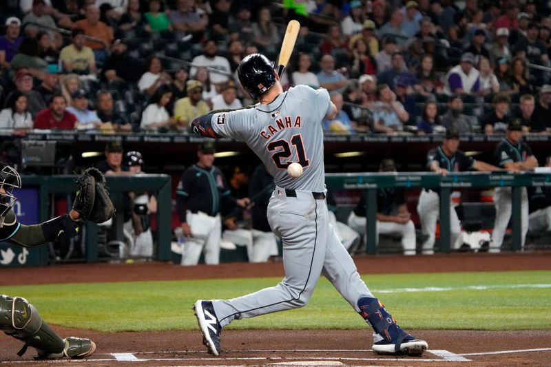 May 17, 2024; Phoenix, Arizona, USA; Detroit Tigers outfielder Mark Canha (21) gets hit with the pitch and strikes out swinging against the Arizona Diamondbacks in the first inning at Chase Field. Mandatory Credit: Rick Scuteri-USA TODAY Sports