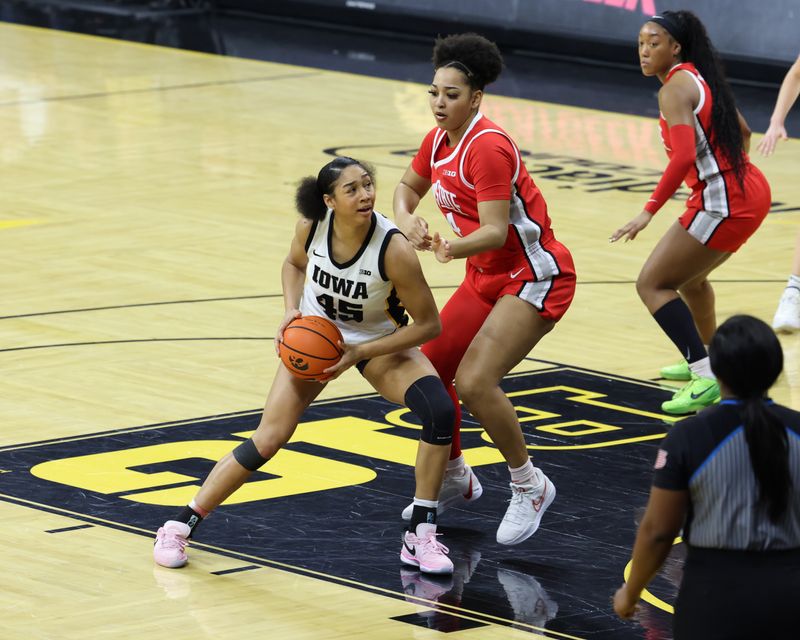 Mar 3, 2024; Iowa City, Iowa, USA; Iowa Hawkeyes forward Hannah Stuelke (45) is defended by Ohio State Buckeyes guard Jacy Sheldon (4) during the first half at Carver-Hawkeye Arena. Mandatory Credit: Reese Strickland-USA TODAY Sports
