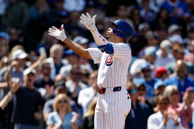 May 3, 2024; Chicago, Illinois, USA; Chicago Cubs third baseman Christopher Morel (5) celebrates as he crosses home plate after hitting a solo home run against the Milwaukee Brewers during the sixth inning at Wrigley Field. Mandatory Credit: Kamil Krzaczynski-USA TODAY Sports