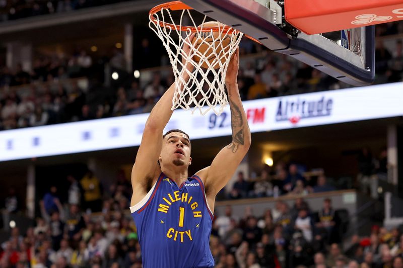 DENVER, COLORADO - JANUARY 12: Michael Porter Jr. #1 of the Denver Nuggets goes to the basket against the New Orleans Pelicans in the first quarter at Ball Arena on January 12, 2024 in Denver, Colorado. NOTE TO USER: User expressly acknowledges and agrees that, by downloading and or using this photograph, User is consenting to the terms and conditions of the Getty Images License Agreement.  (Photo by Matthew Stockman/Getty Images)