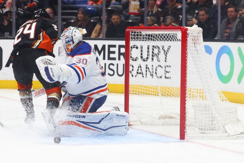 Feb 9, 2024; Anaheim, California, USA; Edmonton Oilers goaltender Calvin Pickard (30) makes a save against Anaheim Ducks center Bo Groulx (24) during the second period of a game at Honda Center. Mandatory Credit: Jessica Alcheh-USA TODAY Sports