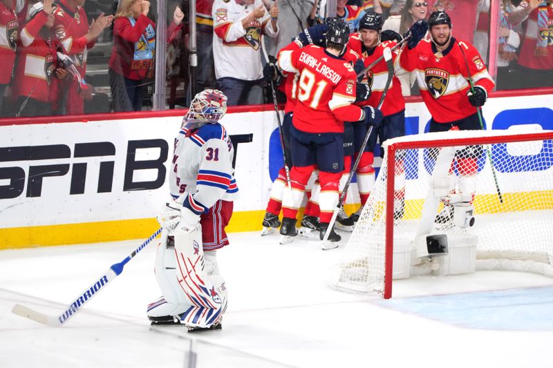 Jun 1, 2024; Sunrise, Florida, USA; Florida Panthers right wing Vladimir Tarasenko (10) celebrates a goal with teammates during the third period as New York Rangers goaltender Igor Shesterkin (31) looks on in game six of the Eastern Conference Final of the 2024 Stanley Cup Playoffs at Amerant Bank Arena. Mandatory Credit: Jim Rassol-USA TODAY Sports