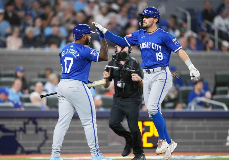 May 1, 2024; Toronto, Ontario, CAN; Kansas City Royals second baseman Michael Massey (19) hits a three run home run and celebrates with designated hitter Nelson Velazquez (17) against the Toronto Blue Jays during the eighth inning at Rogers Centre. Mandatory Credit: Nick Turchiaro-USA TODAY Sports
