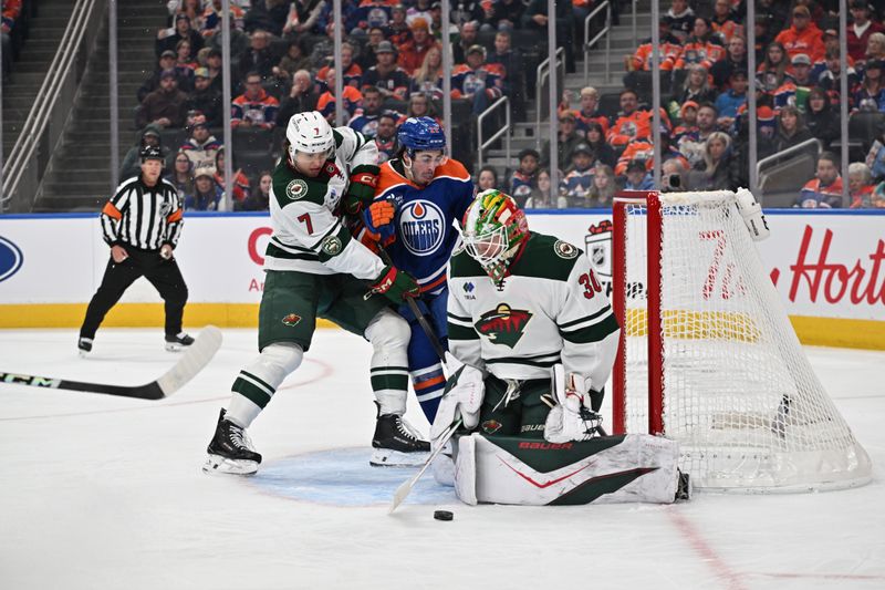 Dec 2, 2025; Edmonton, Alberta, CAN; Minnesota Wild defenseman Brock Faber (7) goes after Edmonton Oilers center Matt Savoie (22) in front of Minnesota Wild goalie Jesper Wallstedt (30) during the first period at Rogers Place. Mandatory Credit: Walter Tychnowicz-Imagn Images