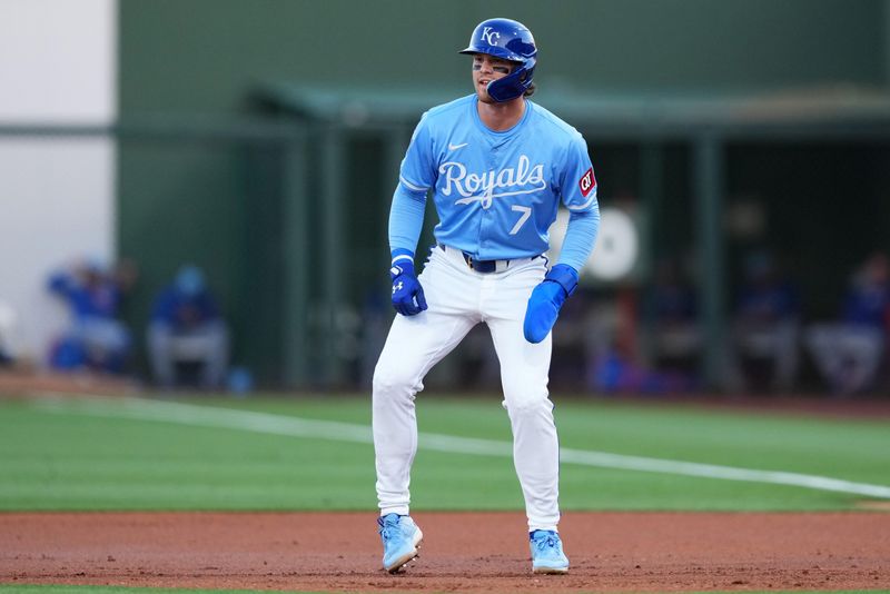 Mar 5, 2024; Surprise, Arizona, USA; Kansas City Royals shortstop Bobby Witt Jr. (7) leads off first base against the Chicago Cubs during the first inning at Surprise Stadium. Mandatory Credit: Joe Camporeale-USA TODAY Sports
