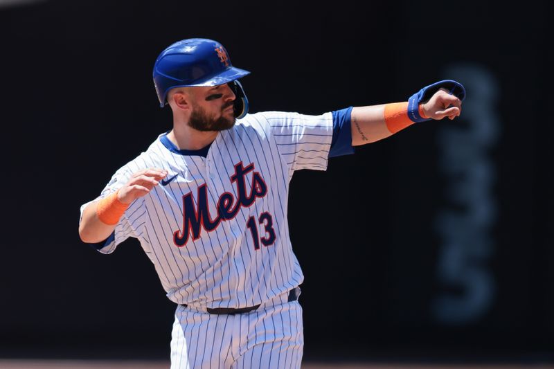 Jul 11, 2024; New York City, New York, USA; New York Mets catcher Luis Torrens (13) reacts after a double during the fifth inning against the Washington Nationals at Citi Field. Mandatory Credit: Vincent Carchietta-USA TODAY Sports